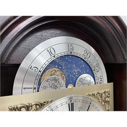 Fenclocks Suffolk - contemporary mahogany longcase clock, stepped arch hood with plain pilaster columns, moon phase dial and silvered Roman chapter ring, with chime set/silent lever, triple weight driven quarter chiming movement