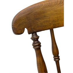 Early 19th century elm farmhouse armchair, the shaped eared cresting rail over tall spindle back, dished seat on turned supports united by H stretchers