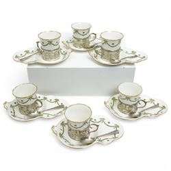 Set of Six Aynsley coffee cans and saucers decorated with garlands, the cans held in pierc...