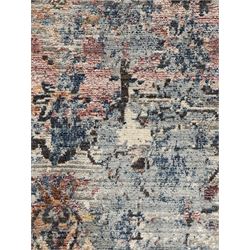Contemporary Dunelm Soraya Persian design rug, blue and beige ground with faded floral and vine motifs, central medallion and trailing foliate patterns, bordered by a distressed design with stylised floral motifs