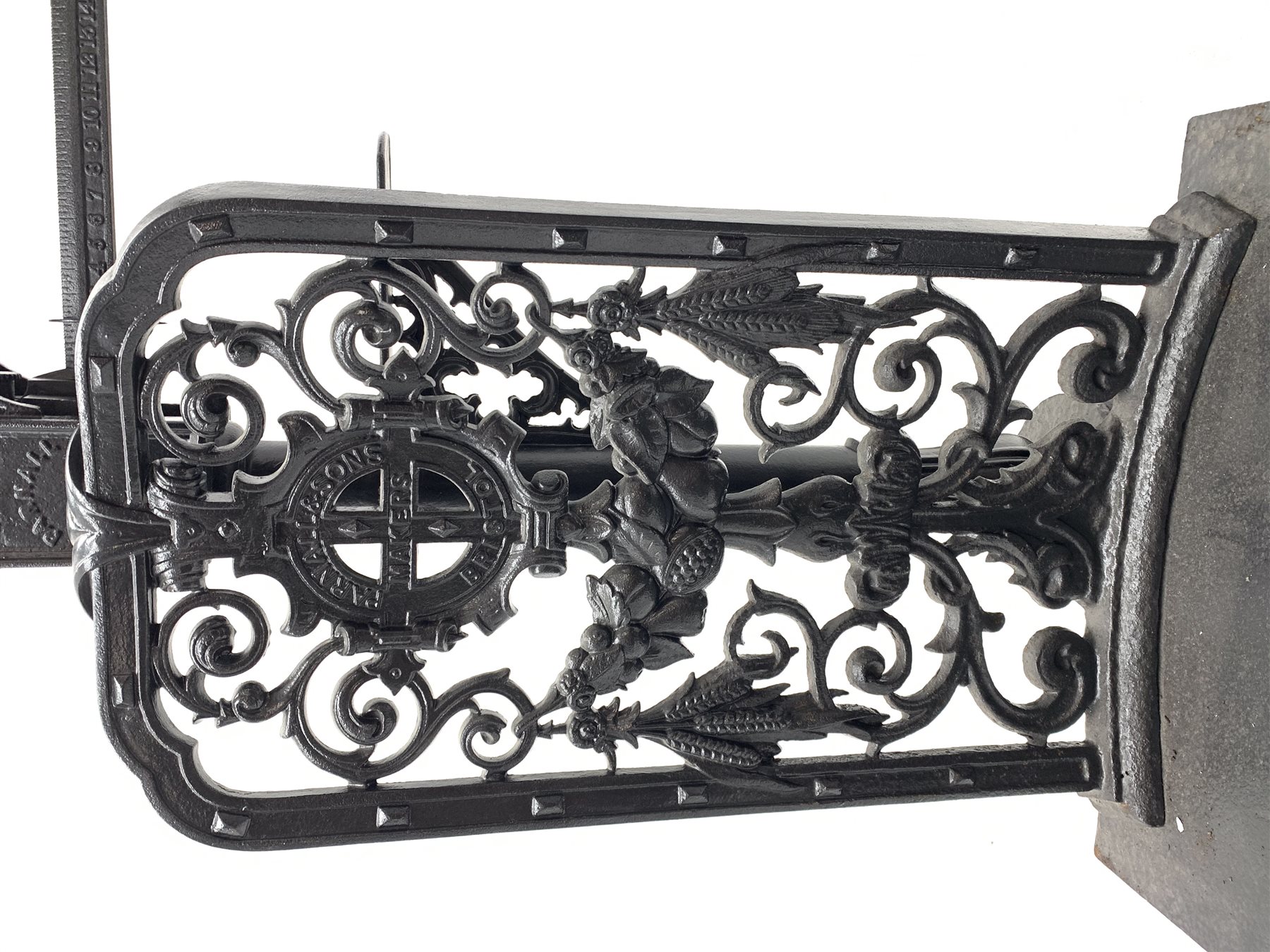 19th century platform scales by Parnall & Sons. Bristol, black painted cast iron, raised back decorated with foliage scrolls and fruit garland, H128cm