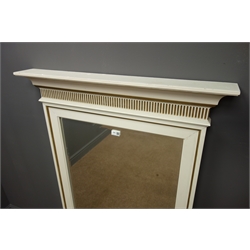 Rectangular bevel edged mirror, projecting cornice above fluting, gold and ivory finish, W85cm, H128cm  
