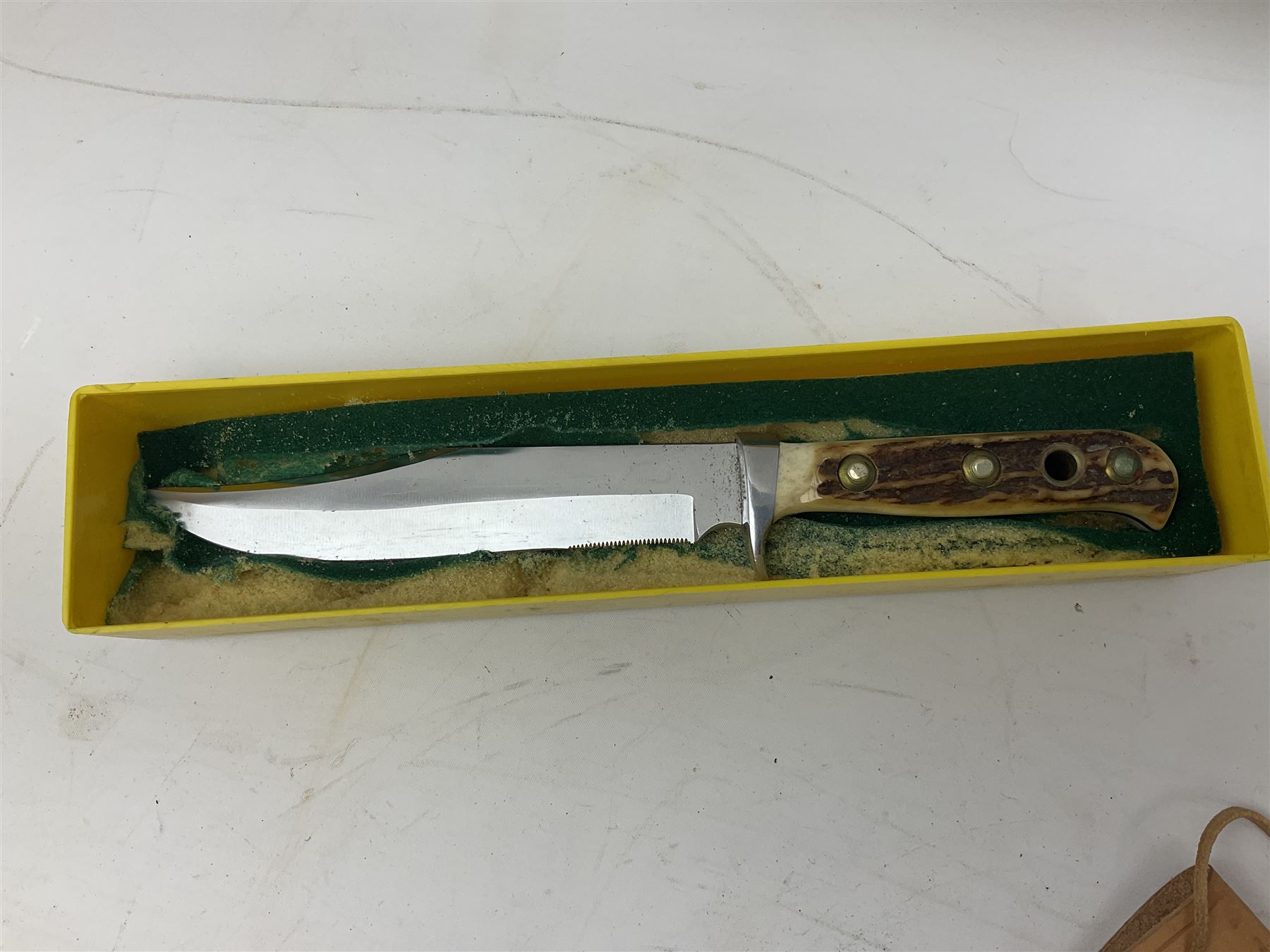 German Original Puma-Bowie knife, with maker's name and number 6396 to the 16.5cm blade, stamped number 73373 to the guard, antler grip, in original hard plastic case with brown leather sheath, also marked Puma