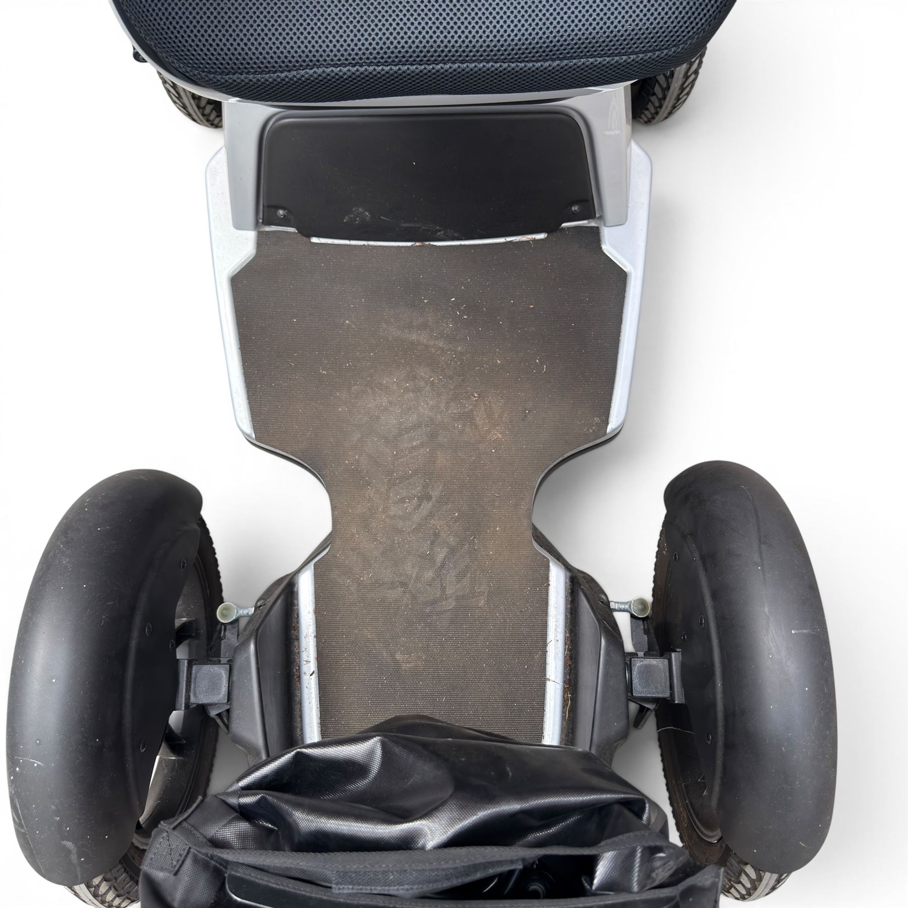 TGA Scoozy - mobility scooter, four wheel model with joystick controls, front storage bag, lights and grey and black bodywork.
