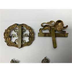 Twenty cap badges including Hertfordshire, Royal Sussex, Cambridgeshire, Hampshire, Notts and Derby, East Surrey, Herefordshire, South Lancashire, Devonshire, Bedfordshire, Durham Light Infantry etc (20)