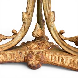 Victorian cast iron garden table, circular pierced top with foliate and scroll decoration, raised on an ornate tripod base with natural weathered paint finish.