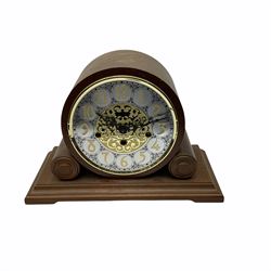 A 20th century  Westminster chime, spring driven three train “William Widdop” wall clock with a visible gridiron pendulum, chiming the hours and quarters on horizontal gong rods, white two-piece dial with roman numerals and minute track, steel spade hands, wooden case with full length glazed door and curved pediment with moulded cornice.
With key.
 
With a 20th century Westminster chime three train mantle clock with Hermle (German)  balance wheel movement chiming on four gong rods, ornate dial with Arabic numerals and minute track, contrasting black pierced steel hands, strike/silent lever.
H23cm W35cm D15cm