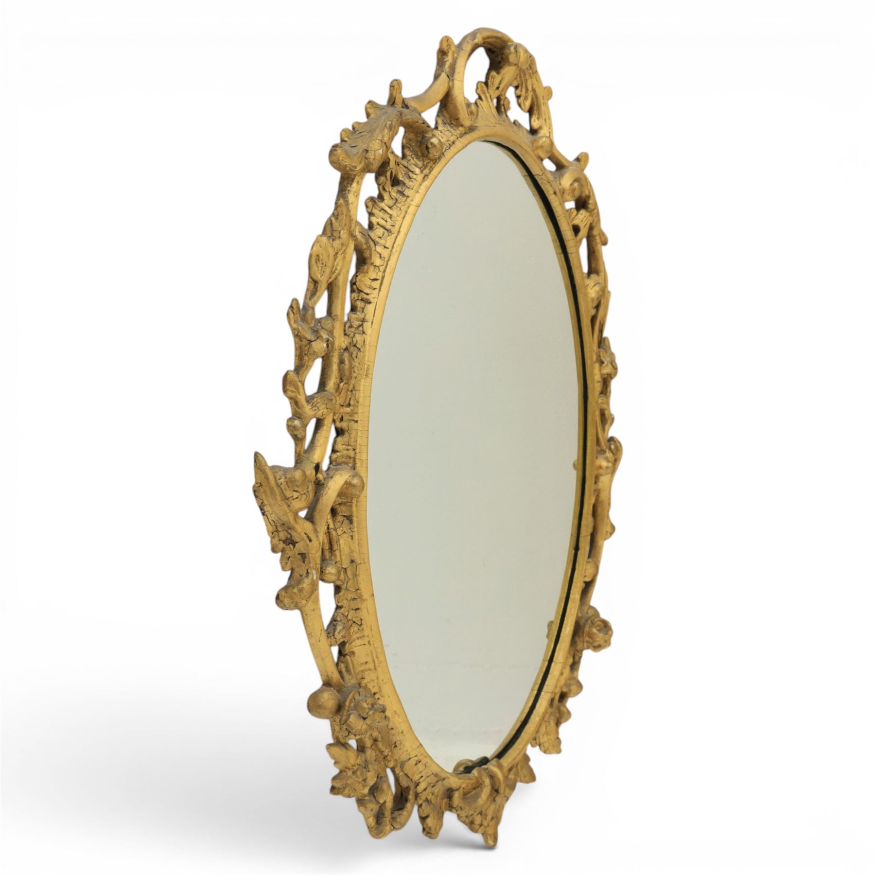 Rococo design gilt framed oval wall mirror, pierced frame with foliate design 