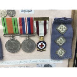 Framed display of medals and badges relating to Captain Cynthia Page of Queen Alexandra's Royal Army Nursing Corps including WW2 War Medal and Defence Medal with miniatures; Red Cross Society 3-Year Service Medal; Q.A.R.A.N.C. cap badge; Girl Guide and silver Scout badges; rank epaulettes; and related photographs 33 x 23cm
