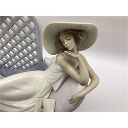 Lladro figure, Garden of Dreams, modelled as a woman reclining in front of trellis of flowers on a mahogany base, limited edition 3561/4000, with original box, no 7634, year issued 1994, year retired 1996, H32cm  