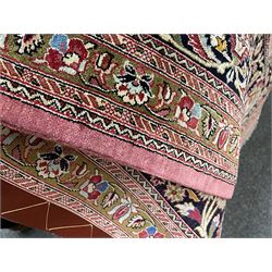 Finely knotted Persian Qom silk rug, overall pink ground with ivory field, the field with central cusped medallion profusely decorated with interlacing foliate and stylised flower heads, multiple band boarder, the main band decorated with a series of stylised motifs and trailing foliage, the outer guard with signature panel 