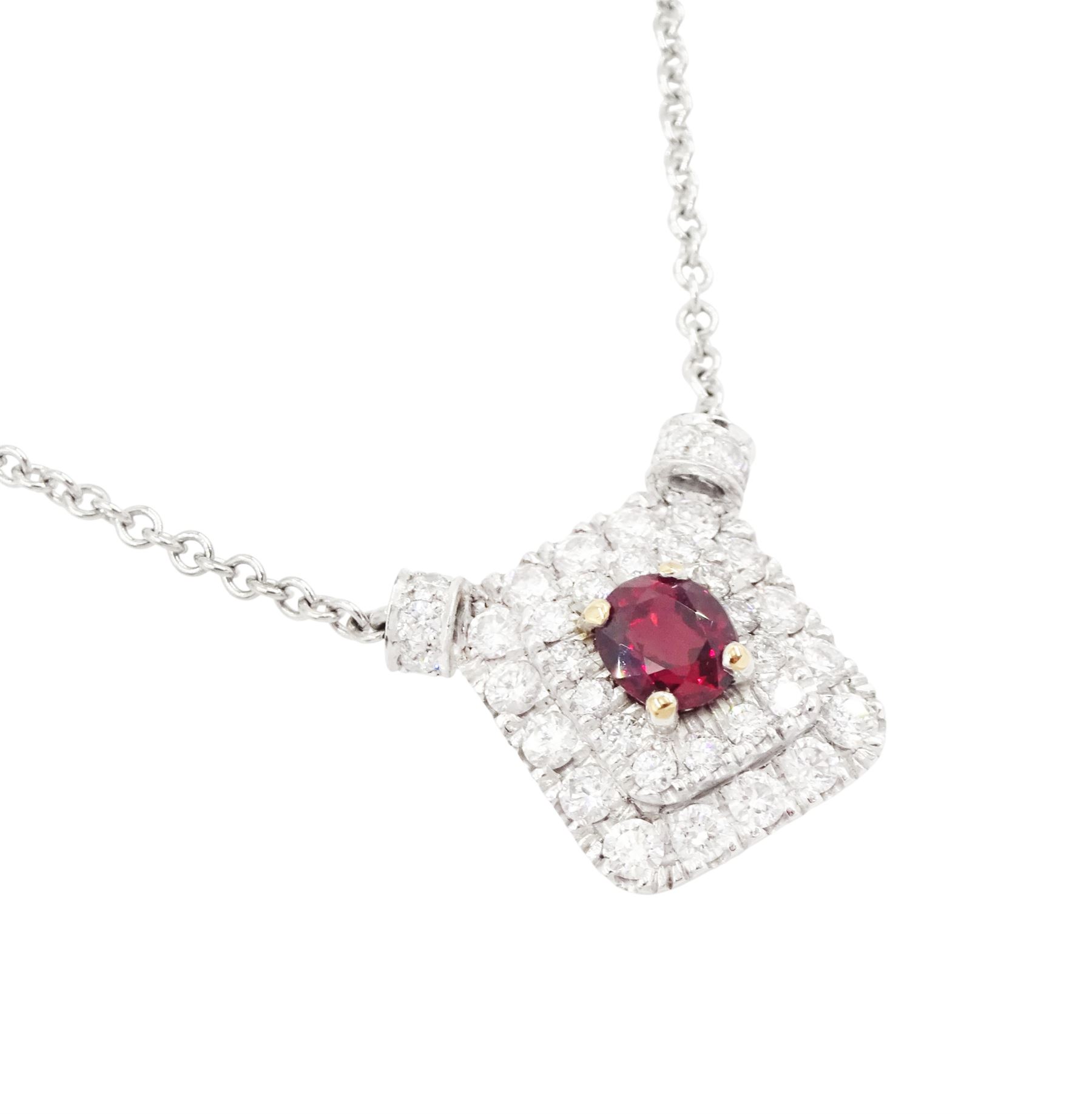 Platinum ruby diamond cluster pendant necklace, single oval cut ruby in a four claw 18ct rose gold setting of approx 0.58 carat, surrounded by two rows of round brilliant cut diamonds, London 2018, total diamond weight approx 0.84 carat, with Alan Poultney Gems report