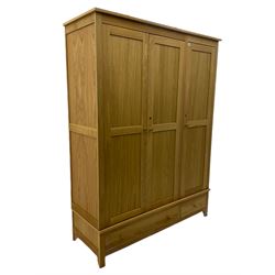 Corndell Furniture - light oak triple wardrobe, enclosed by three panelled doors, one long and one short drawer