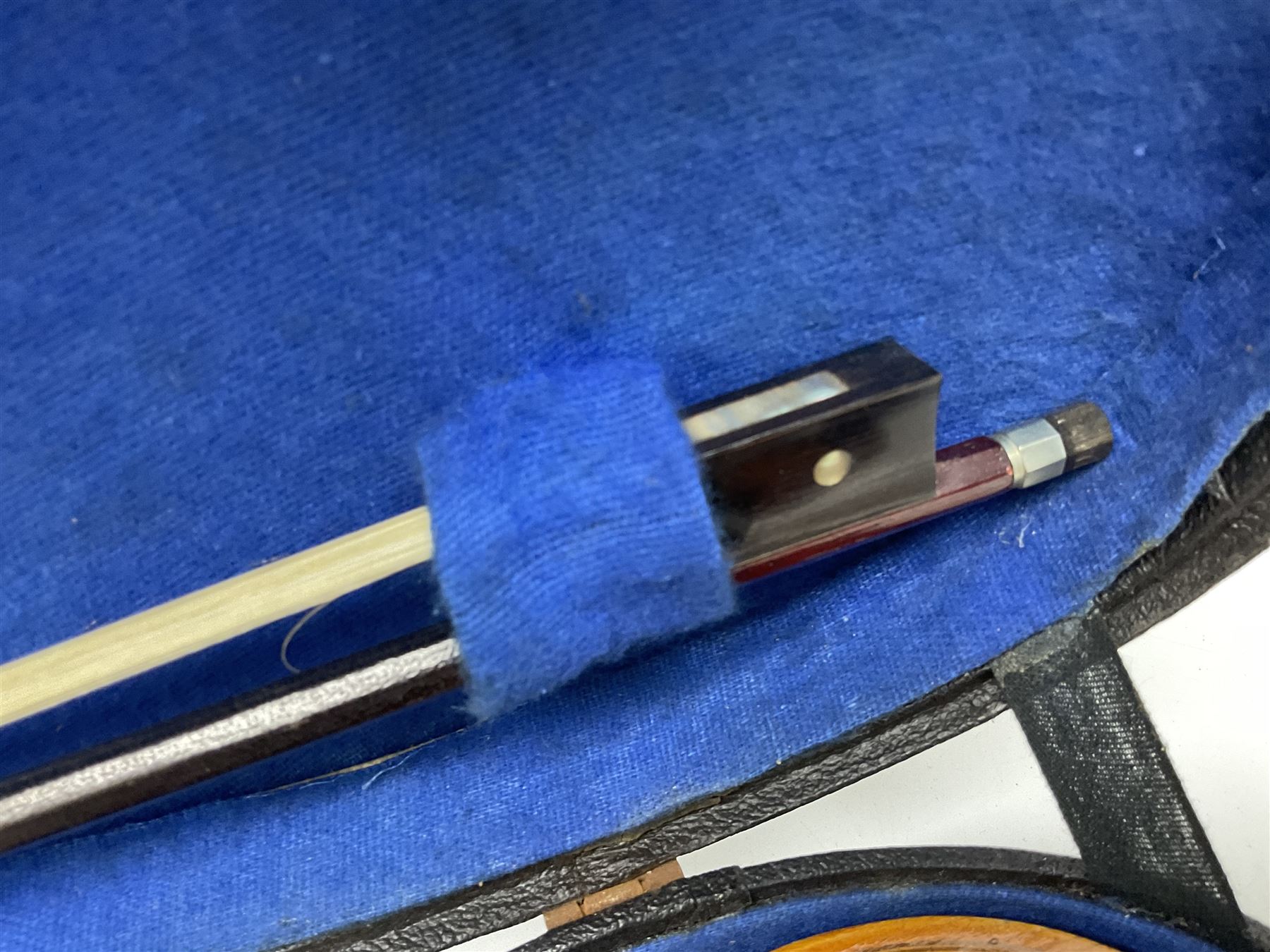 Czechoslovakian violin c1920 with 36cm two-piece maple back and ribs and spruce top, bears label 'Copy of Antonius Stradivarius Made in Czechoslovakia' L59cm; in carrying case; 1950s Czechoslovakian violin; and 195os Czechoslovakian three-quarter size violin; both cased (3)