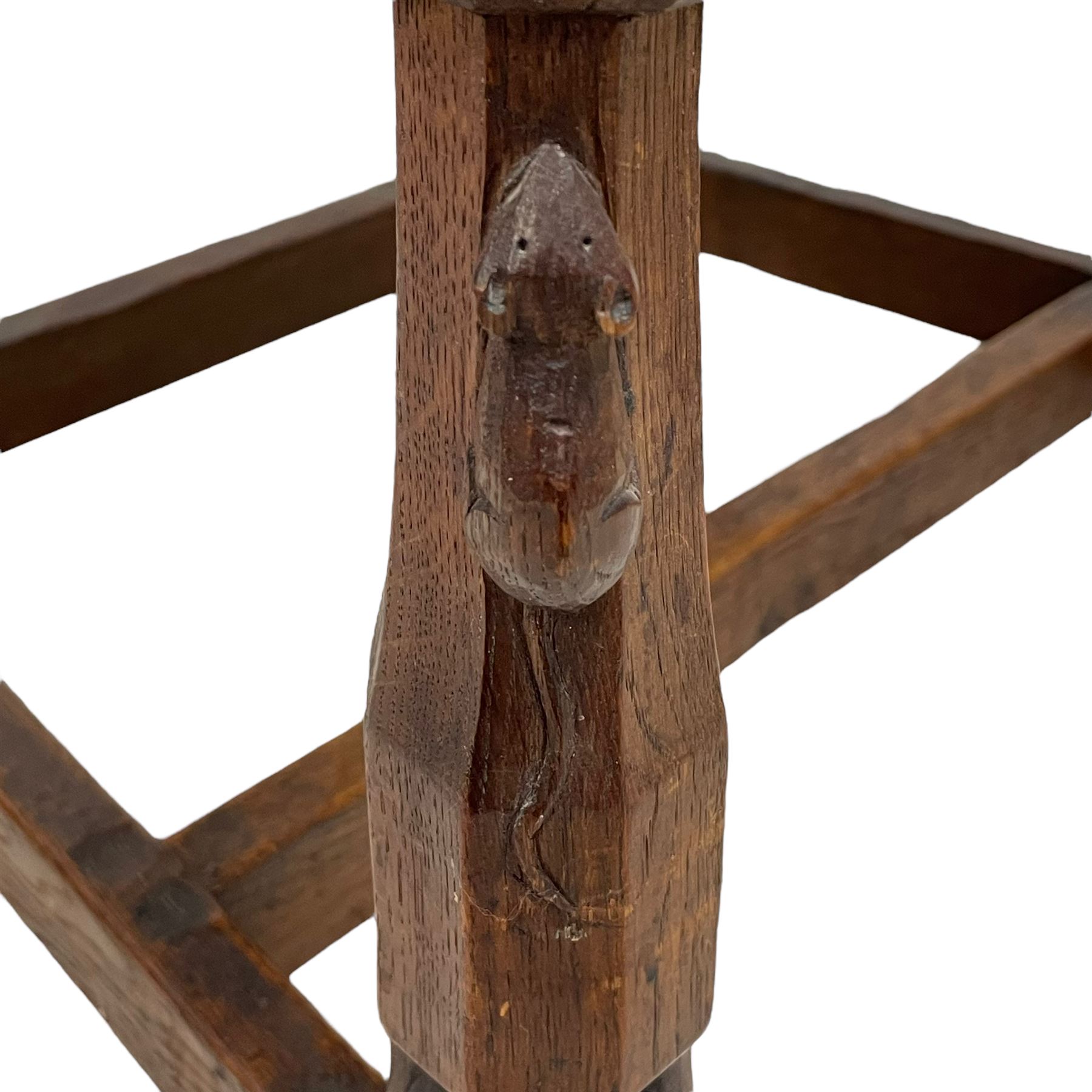 Mouseman - circa. 1930s set of six (4+2) oak dining chairs, panelled back carved with the Bagshawe family crest, the moto 'Forma Flos Fama Flatus' over an arm grasping a bugle-horn with ribbon tie and Yorkshire rose motif, adzed frame, leather lattice strap seat, on octagonal supports united by stretchers, two carvers and four side chairs, each carved with mouse signature, by Robert Thompson of Kilburn 

Provenance: Owned since manufacture by the Bagshawe family, descendants of the Staithes Group Artist Joseph Richard Bagshawe RBA (1870-1909).