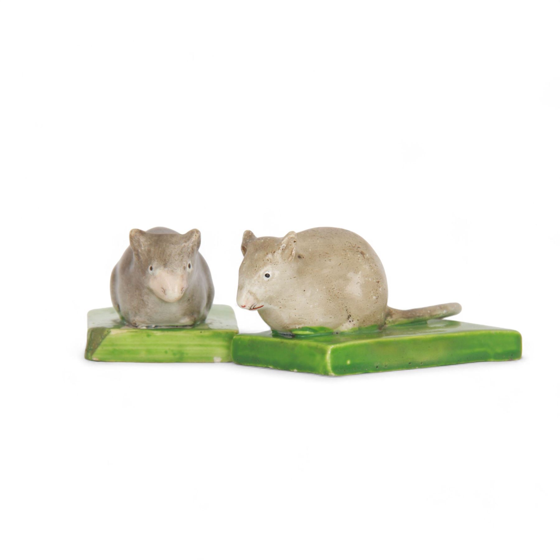 Pair of rare early 19th century Staffordshire pottery figures, circa 1820, modelled as mice resting upon green rectangular bases, H3.5cm L9cm

Footnote: Figures such as these are very rare, few examples have survived and are thought to have been played with as toys
