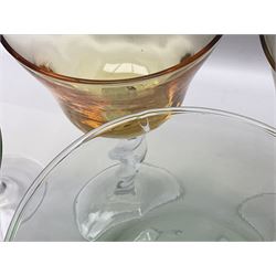 Ten coloured Adriana wine glasses by Abigails, to include blue, green, pink and yellow examples, each with part faceted bowl and twist stems, together with two similar orange examples with pulled stems, H24cm