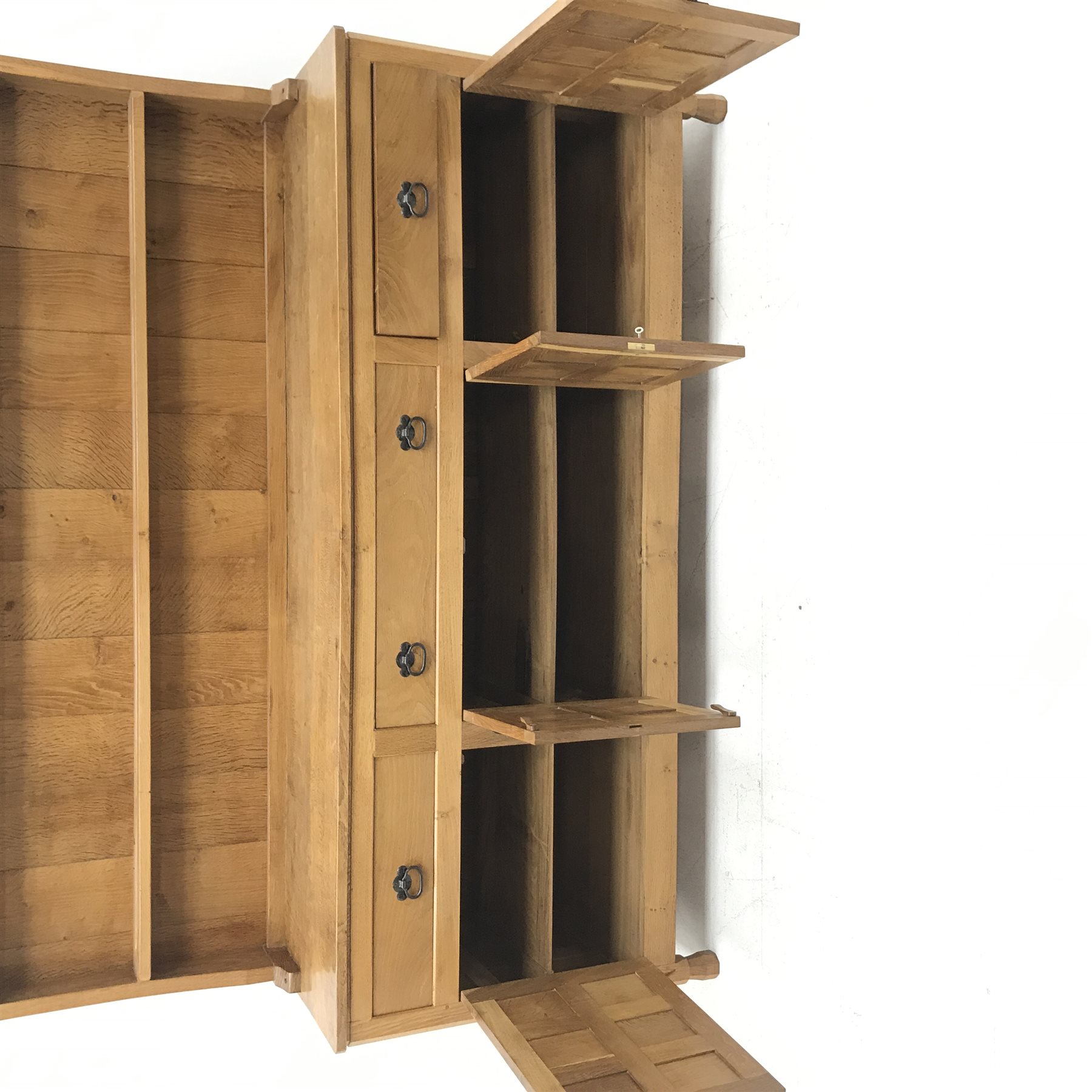 'Lizardman' panelled oak dresser, two heights plate rack above base fitted with three drawers, double cupboard and two single cupboards, by Derek Slater of Crayke, W181cm, H167cm, D45cm