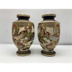 Pair of early 20th century Japanese Satsuma vases, decorated with immortals, with painted mark to base, H26cm