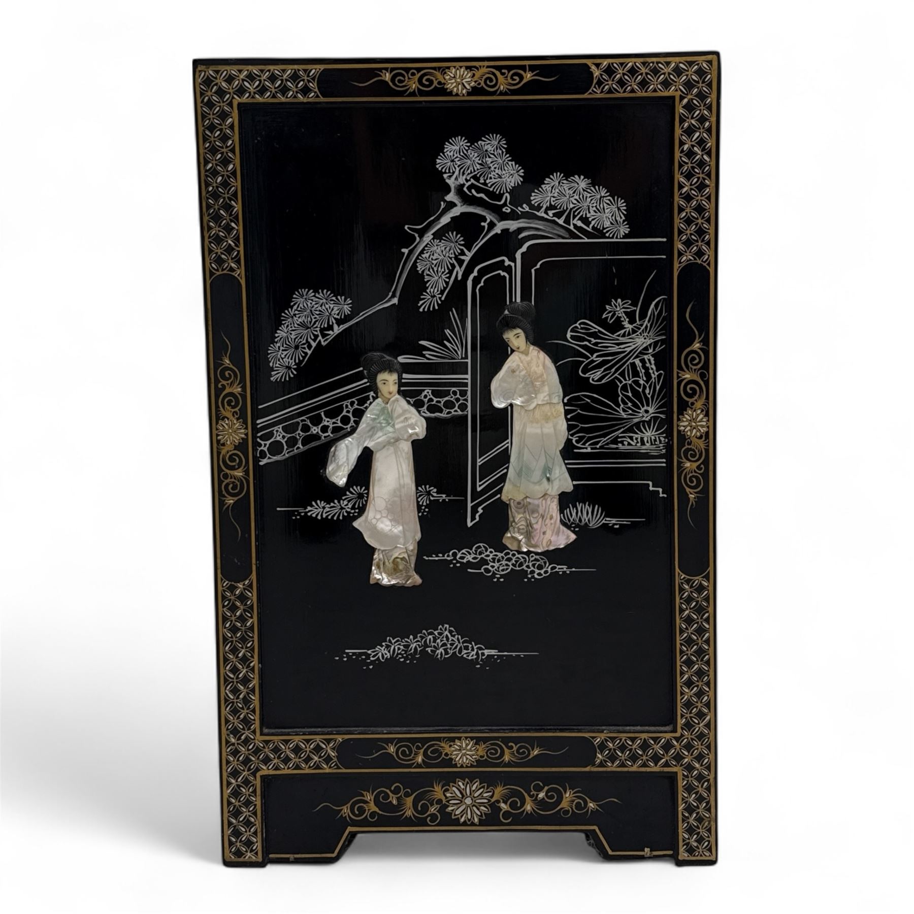 20th century Japanese Shibayama style black lacquered cabinet, rectangular form decorated with mother-of-pearl and hardstone figural inlay, the top with four standing figures, single frieze drawer above two cupboard doors, gilt painted borders and landscape