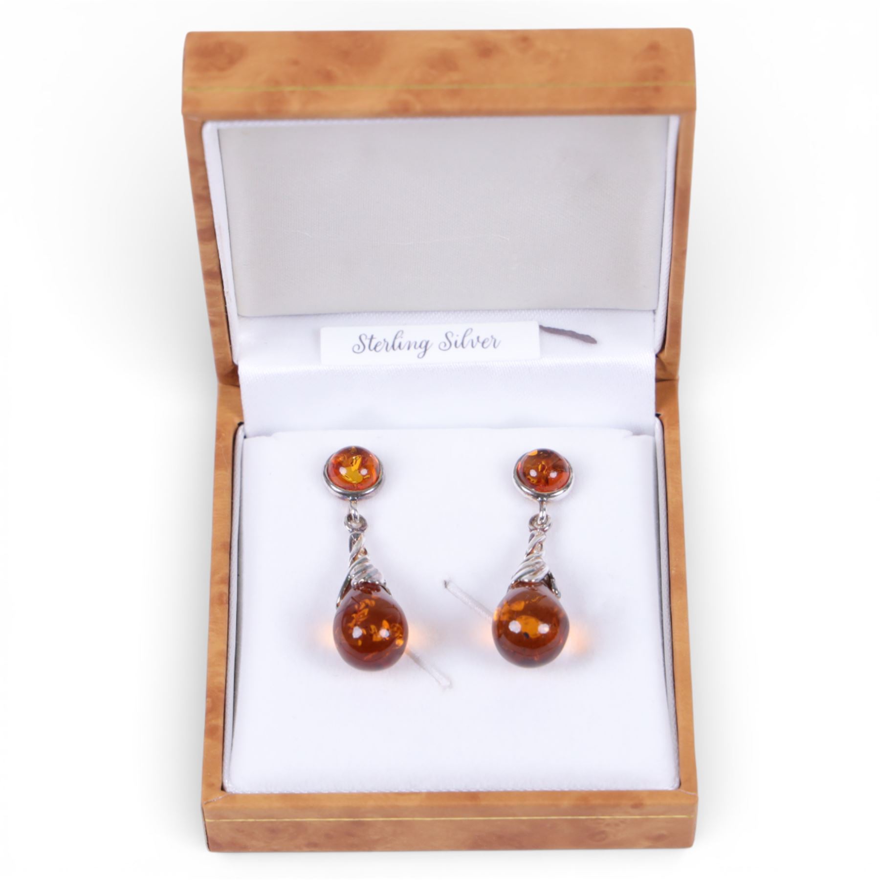Pair of silver Baltic amber pendant stud earrings, boxed