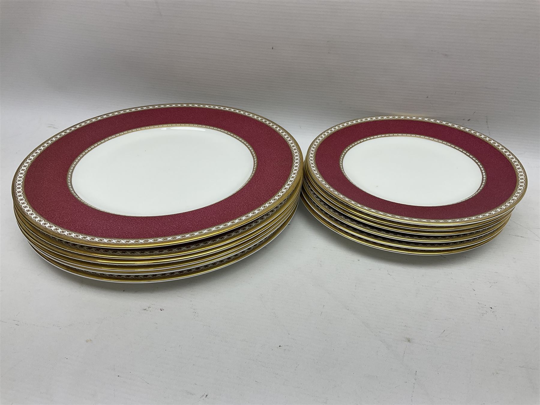 Wedgwood Ulander powder ruby pattern part dinner service, comprising six dinner plates, six side plates, six dessert plates, six soup bowls and sauce boat