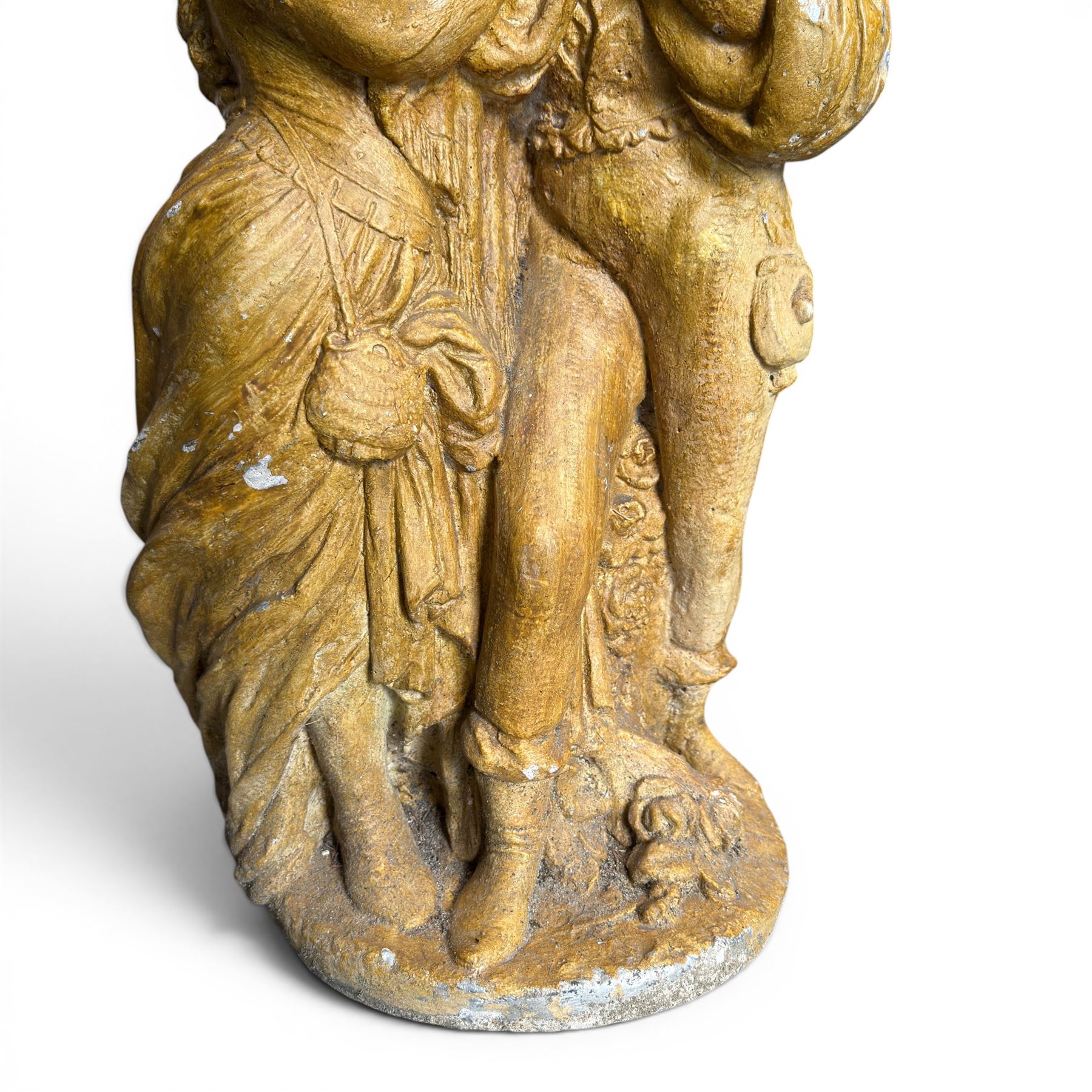 Composite garden statue group of Romeo and Juliet embracing in Medieval dress, surmounted on a naturalistic foliate base, in antique distressed glazed finish