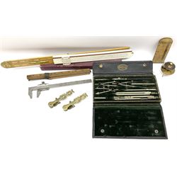 Two Victorian brass sovereign scales, one marked 'Harrison' L10cm; cased set of drawing instruments by G. Thornton Limited Manchester; Chesterman No.770/1 steel vernier caliper; two boxwood rulers; cased slide rule; brass and boxwood rope/wire gauge etc