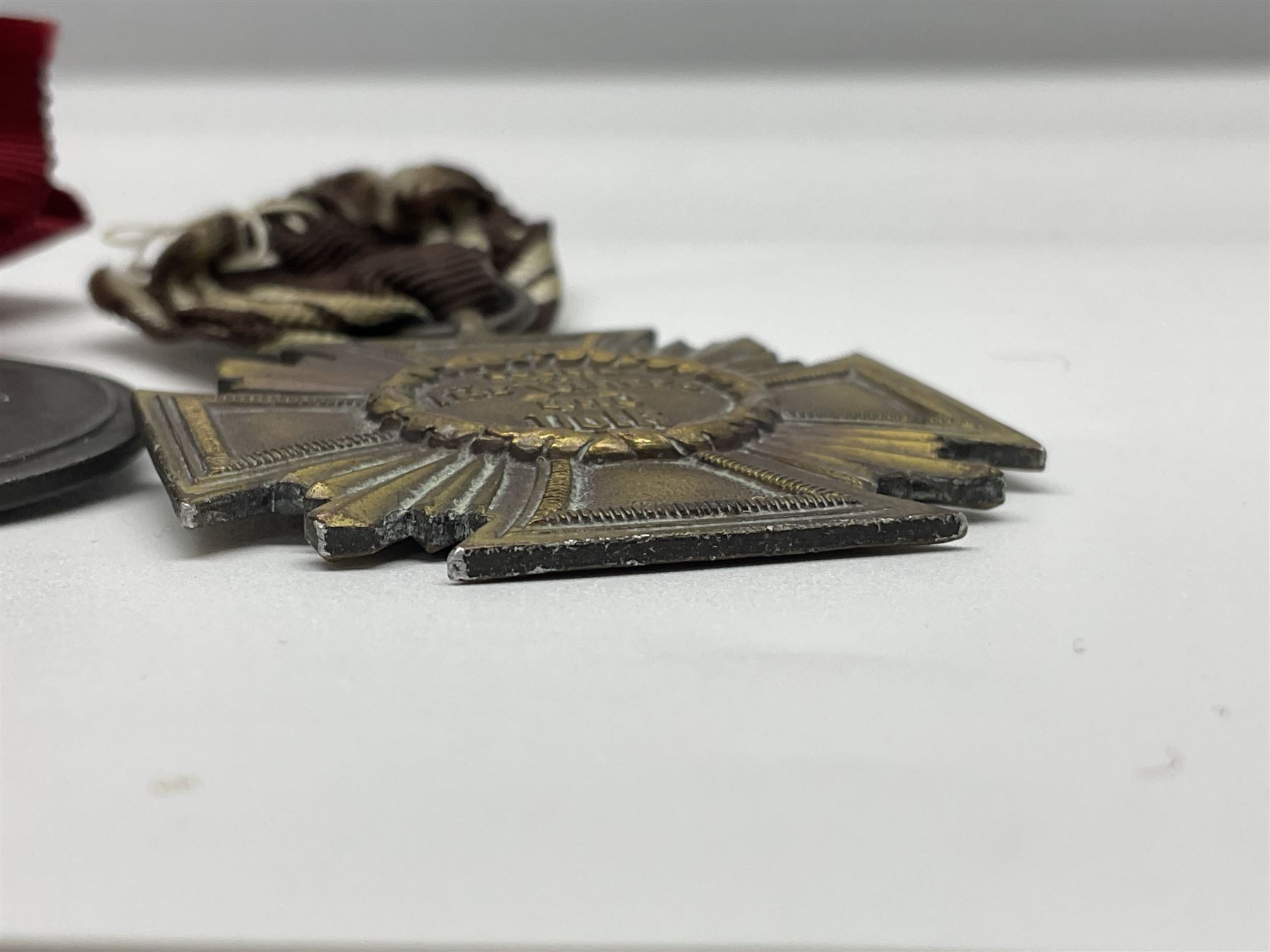 WW2 German Eastern Front Medal awarded to those who served on the German Eastern/Russian Front during the Winter Campaign period of 15th November 1941 to 15th April 1942 with original ribbon; German War Merit Cross with swords; and NSDAP Long Service Award (3)