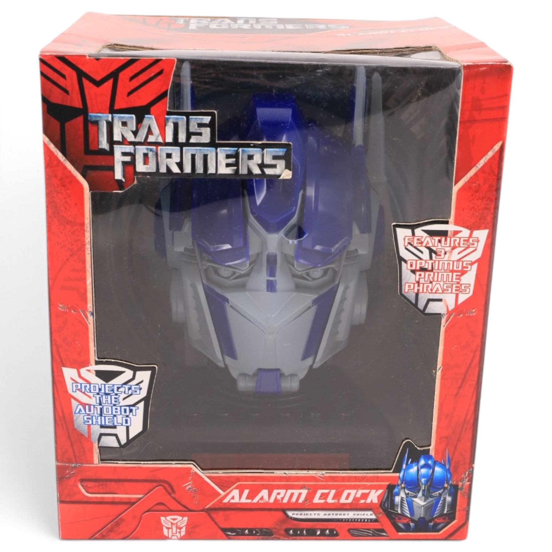 First 4 Figures Transformers Optimus Prime vs. Megatron model, together with a Hasbro Transformers Bumble Bee bust and a Hasbro Transformers Alarm Clock, all boxed
