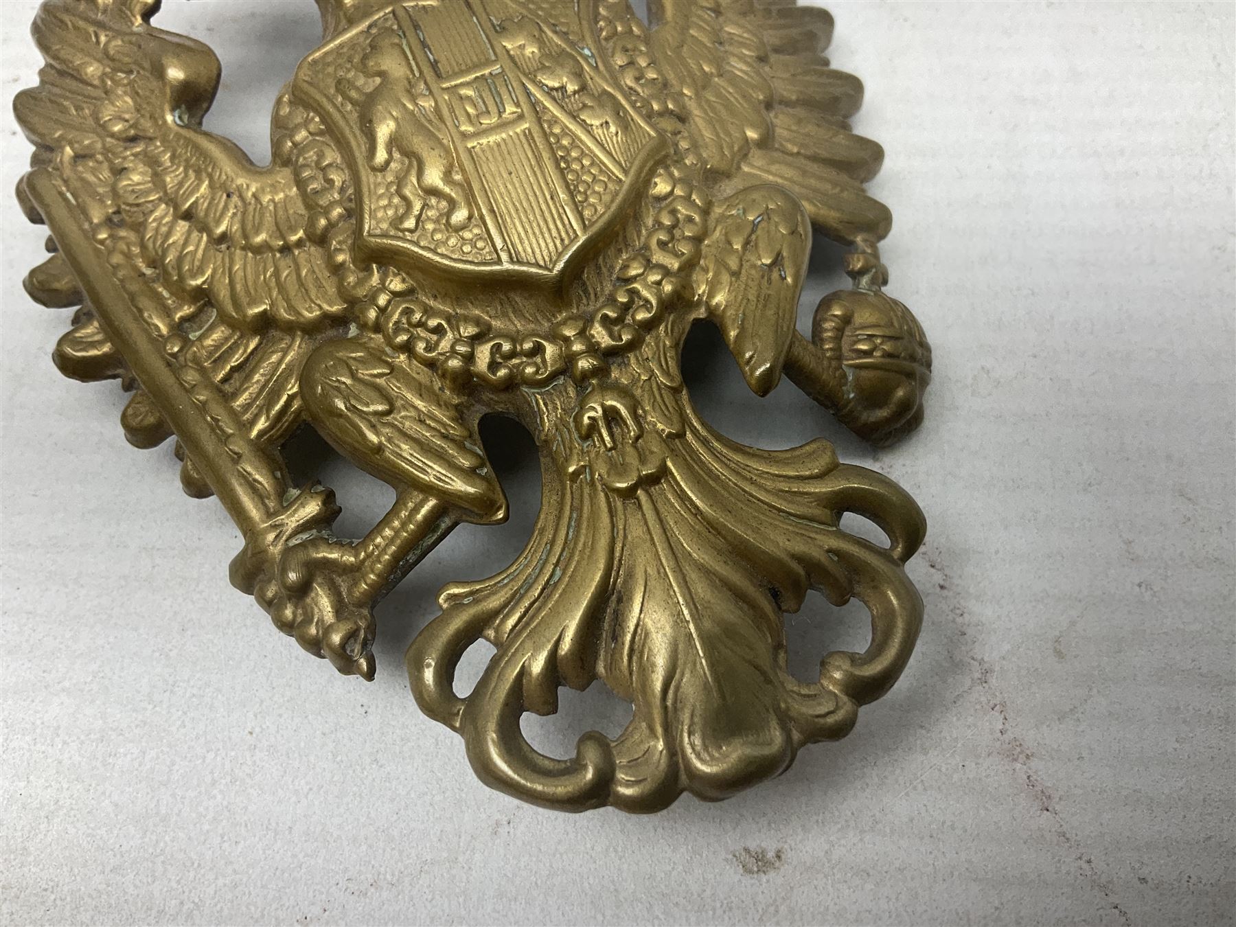 Austrian shako plate 1890 - 1914 with three fixing eyes verso