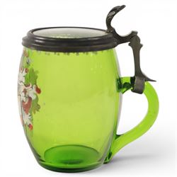 19th century German green glass stein, enamel decorated with a gentleman holding a stein, with a pewter lid, together with another smaller example decorated with a coat of arms 