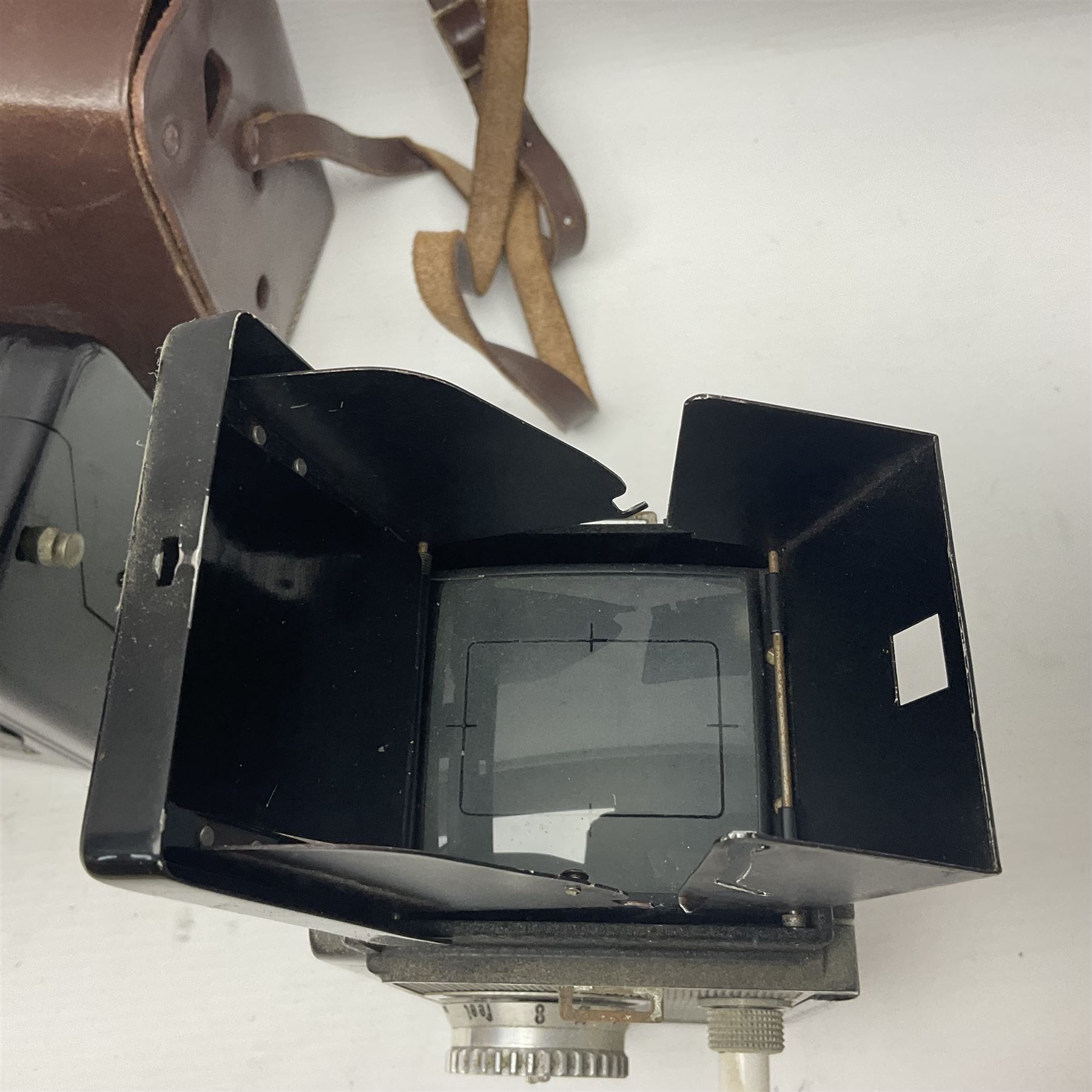 Franke & Heidecke Rolleicord twin lens camera, serial number 012706 with Heidoscop-Anastigmat f=7.5cm' lens and a 'Carl Zeiss Jena Triotar 1:4.5 f=7.5cm' lens, serial no 1474898, together with three similar cameras, including SEM TLR, serial no 420218, Ising Pucky box and Ferrania Elioflex, three in leather carry cases