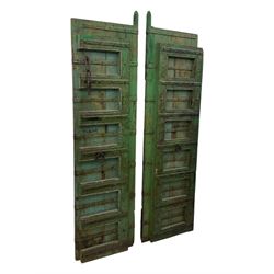 Pair of green-painted Indian doors, c.1860–1880, made from solid teak featuring original iron work and hand-painted finish