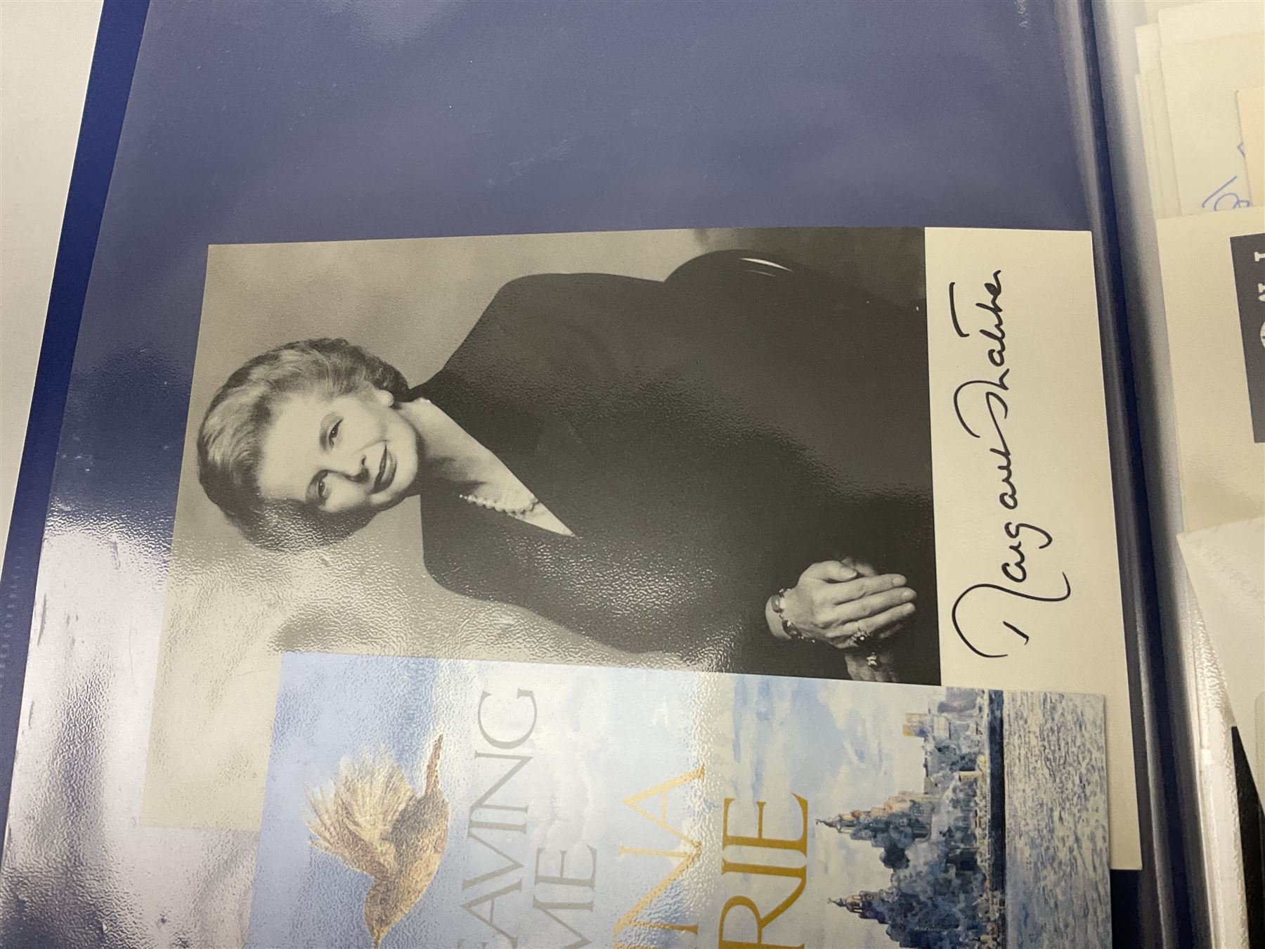 Two folders of over fifty photographs, cards, compliment slips etc of actors, actresses, celebrities, politicians, sports personalities etc, all bearing signatures, including David Frost, Lloyd Grosman, John Suchet, Julia Somerville and othe GMTV presenters, Carol Vorderman, Jackie Collins, Rolf Harris, Timothy Dalton, Pete Postlethwaite, Magnus magnusson, John Major, Kate Moss, Uri Geller, David Beckham, Peter Alliss, Sharon Davies, Kevin Keegan etc