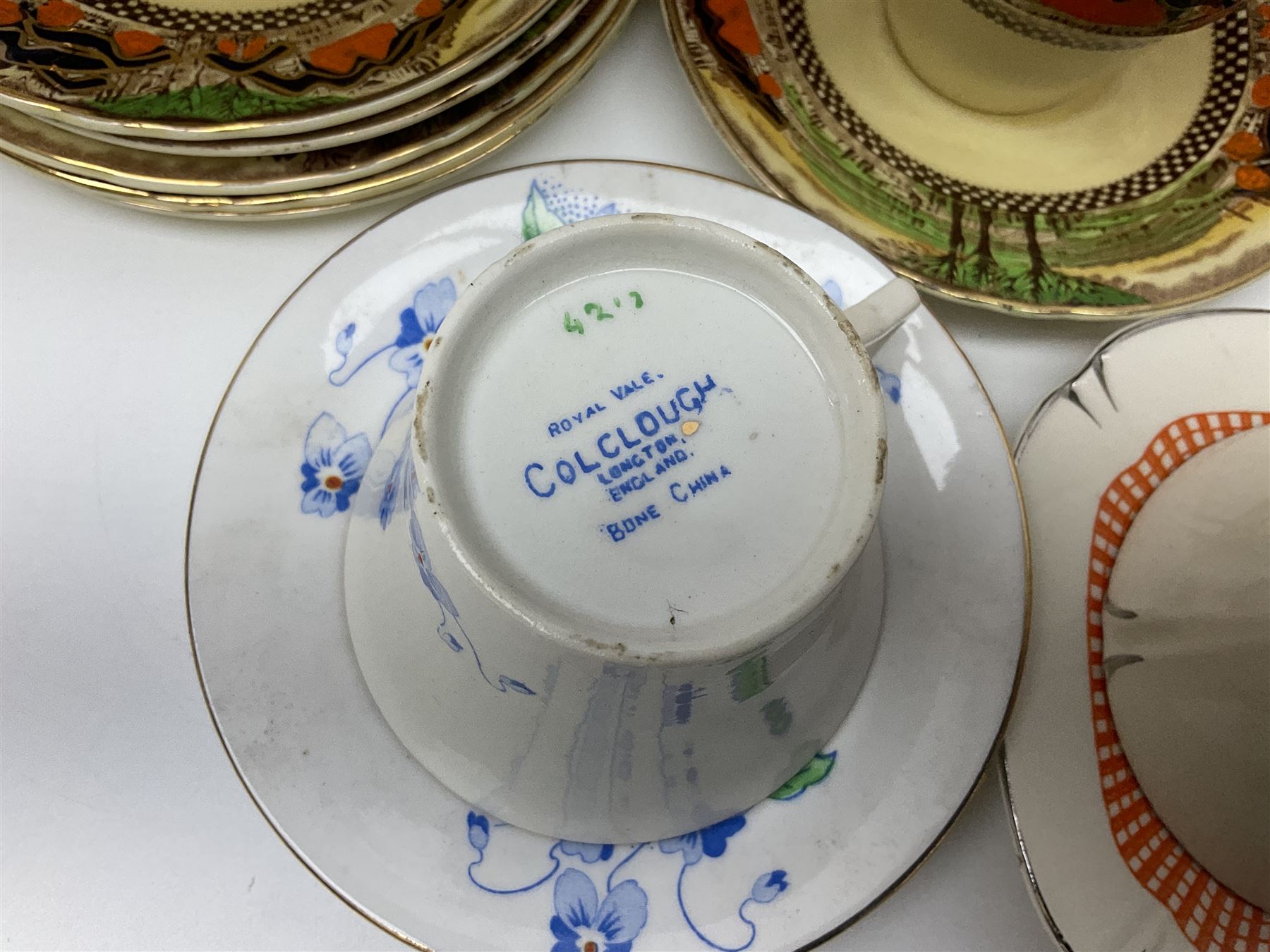 Four Portmeirion storage jars with Greek key pattern on an orange ground, together with Tams Ware tea service and other ceramics