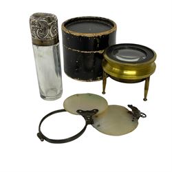 Hallmarked silver capped glass scent bottle of cylindrical form, the screw thread cap with foliate decoration, circular fold out magnifying glass in mother of pearl case, and brass map magnifier in box, bottle L7cm