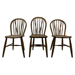 Set of six early to mid-20th century Windsor type elm and beech chairs, hoop and stick back with dished seats, on turned supports with H shaped stretcher