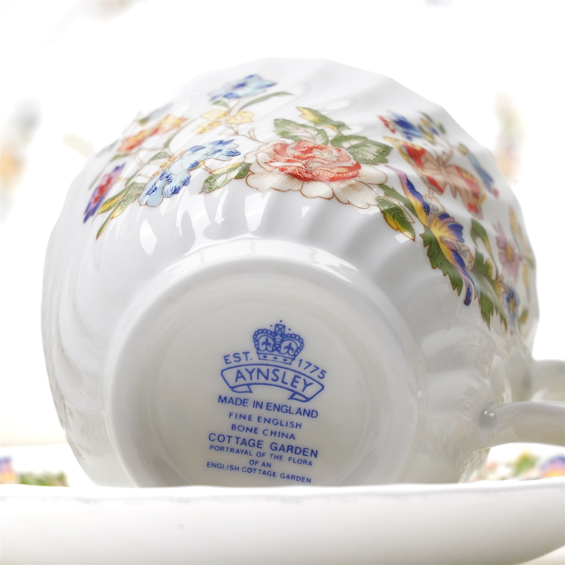 Aynsley Cottage Garden tea set comprising thirteen cups and saucers, eleven plates, bread and butter plate and milk jug, together with six coffee cans and saucers, cream jug and sugar bowl and four other Cottage Garden pieces