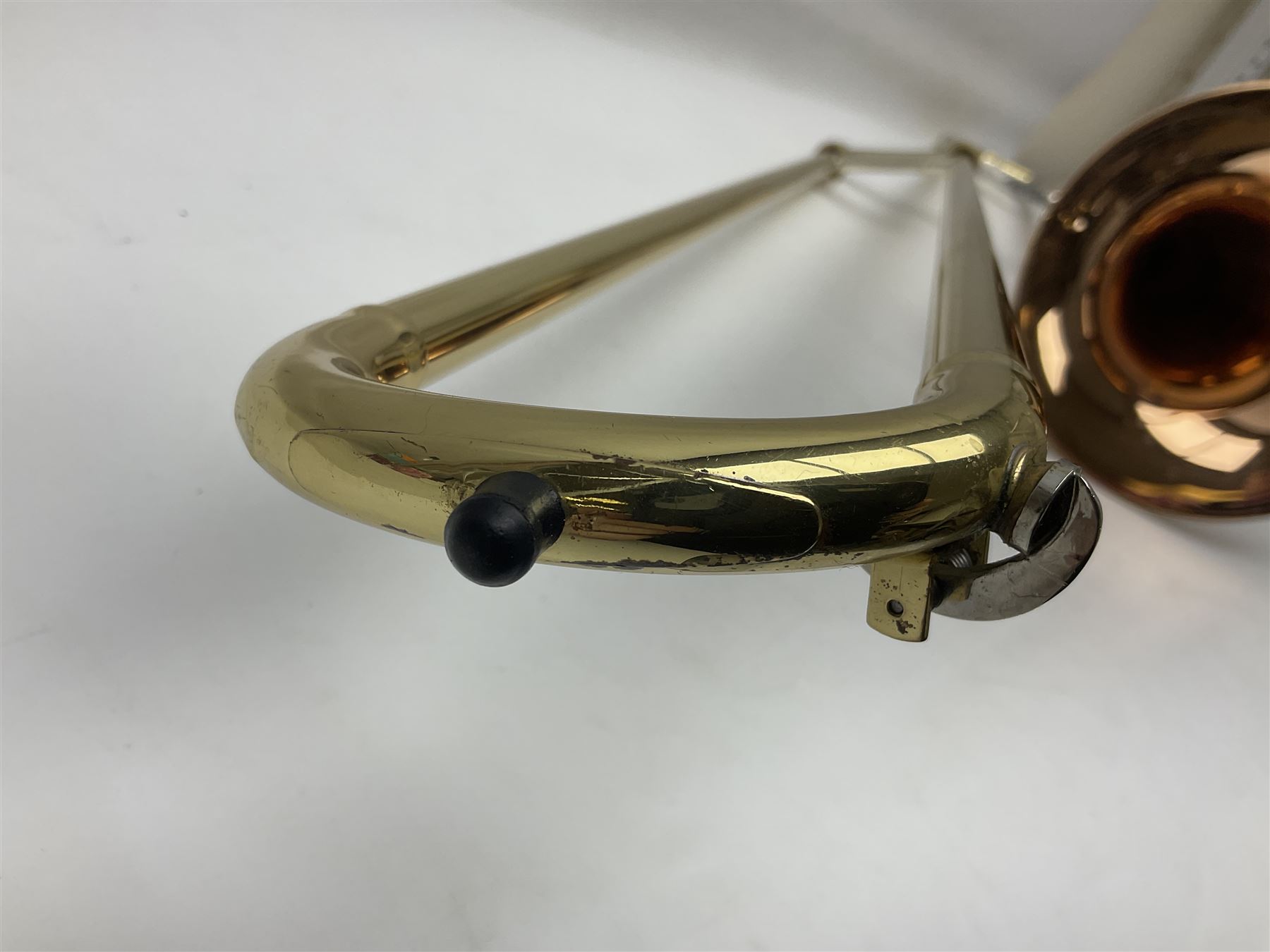 Sebastian Bucklet Aquae Sulis copper and brass trombone No.0910004; in lightweight carrying case; and Kinsman folding tubular chrome music stand in case (2)