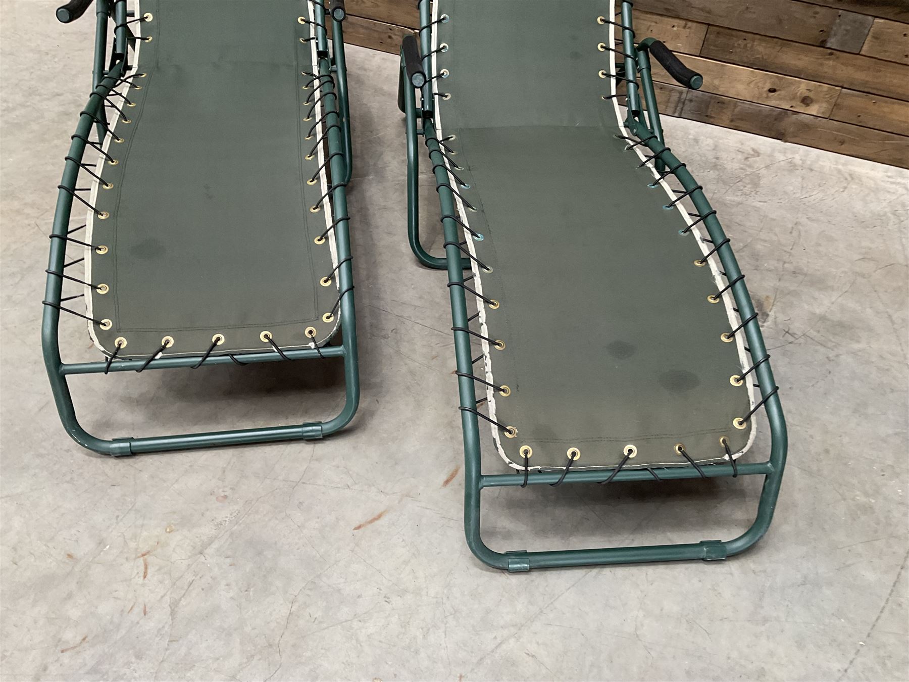 Pair metal framed folding sun loungers