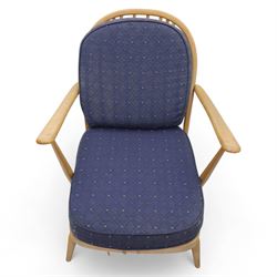 Ercol - Model '203', pair of easy chairs, with blue upholstered cushions and additional orange covers, with looped backrest and shaped spindles, outward swept arms, drop in seat frame