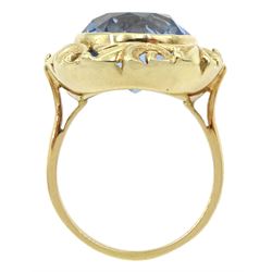 18ct gold single stone round synthetic blue spinel ring, with pierced leaf border