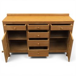 Mouseman - adzed oak dresser, fitted with six drawer and two cupboards, with carved mouse signature, by the workshop of Robert Thompson of Kilburn