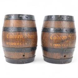 Pair of oak cased sherry barrel with metal strappings, H35cm