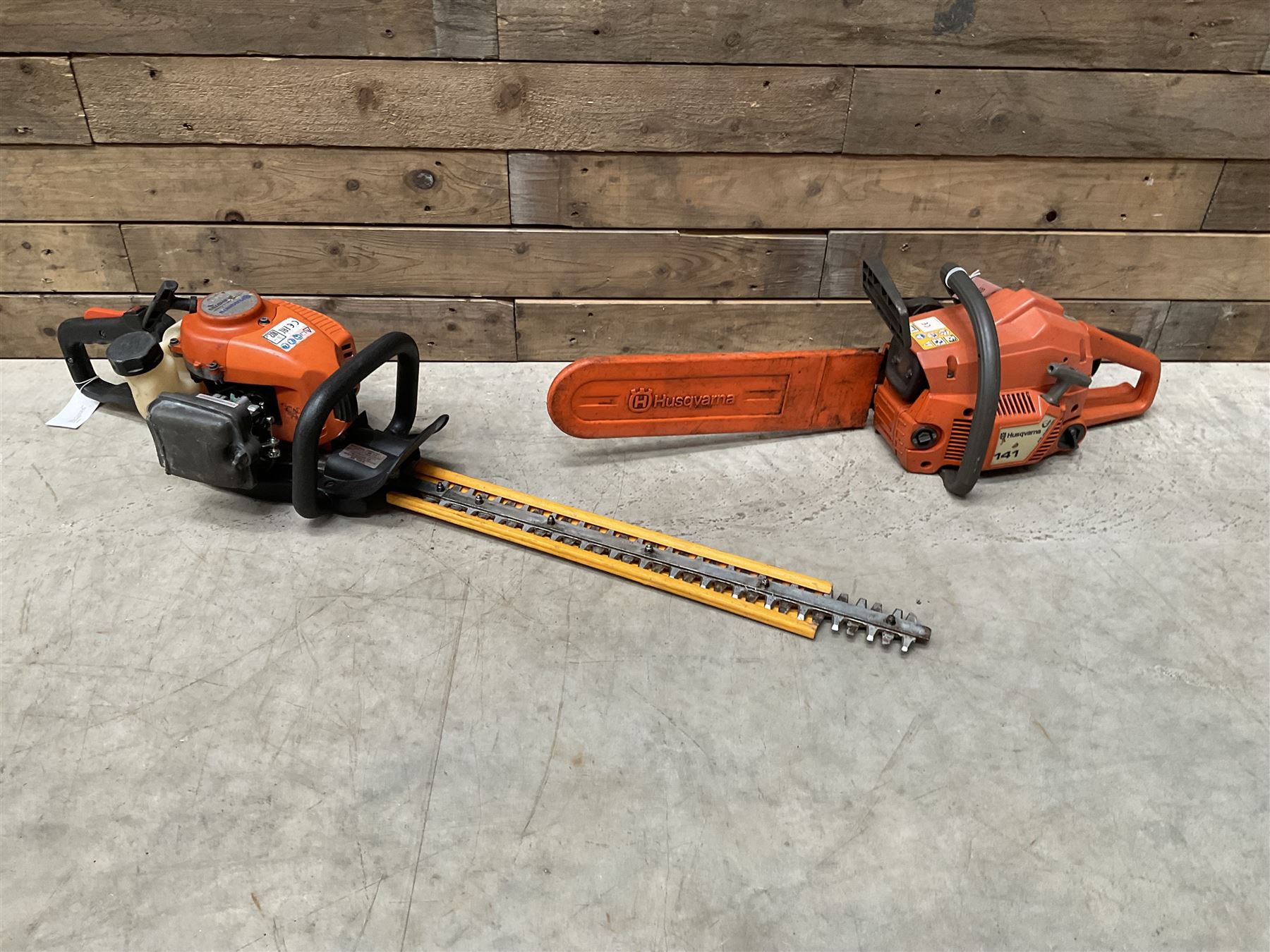 Husqvarna 141 petrol chainsaw and a Husqvarna 226HD75S petrol hedge cutter