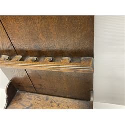 George III oak spoon rack and candle box, the rectangular backplate with shaped  pediment and two six aperture spoon racks, above a candlebox with hinged cover, with various brass spoons and a pair of brass candle snuffers, H56.5cm, W35cm, D14cm 