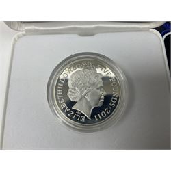 The Royal Mint United Kingdom 2000 'Millennium' silver proof five pound coin and 2011 'The Royal Wedding' silver proof piedfort five pound coin, both cased with certificates