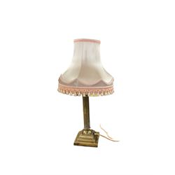 Cased Singer sewing machine, with two table lamps including a brass corinthian column example