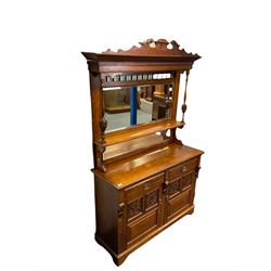 Edwardian oak mirror back sideboard, raised shaped pediment carved with acanthus leaves over Greek key frieze, bevelled mirror back, fitted with two drawers and two cupboards